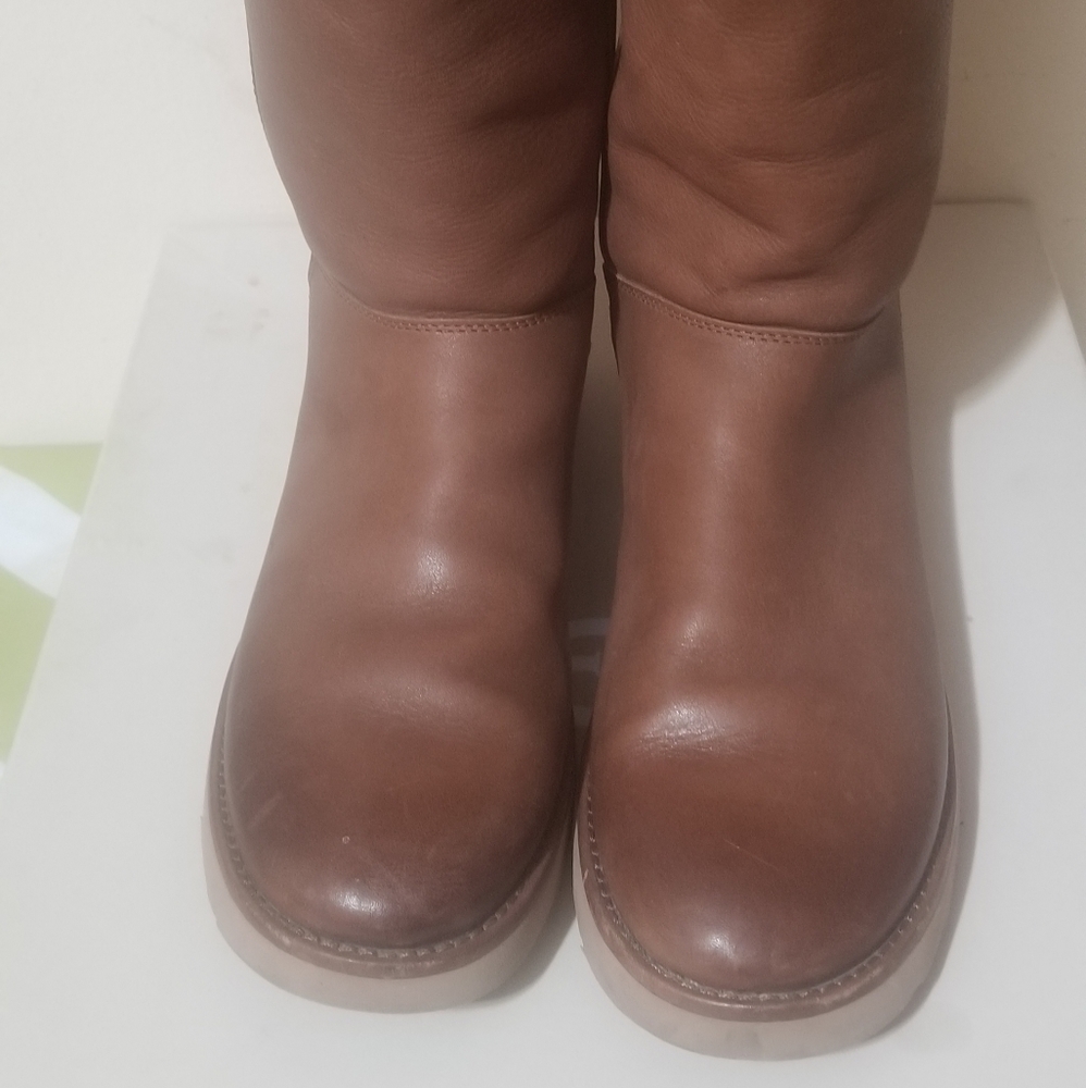 Brown leather UGGS Abree II with side zipper. Used but looks like new